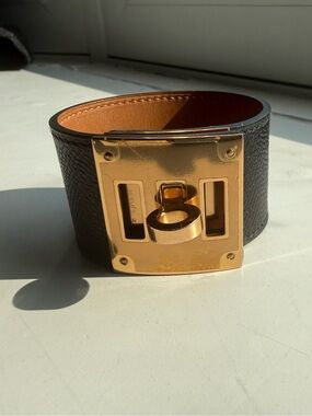 Hermes Black leather Kelly DOG bracelet with gold hardware.